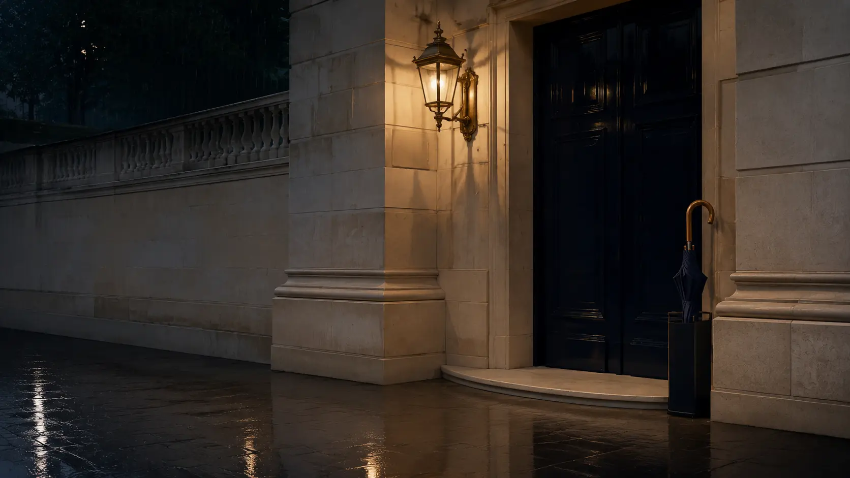A private stone entrance illuminated in the rain